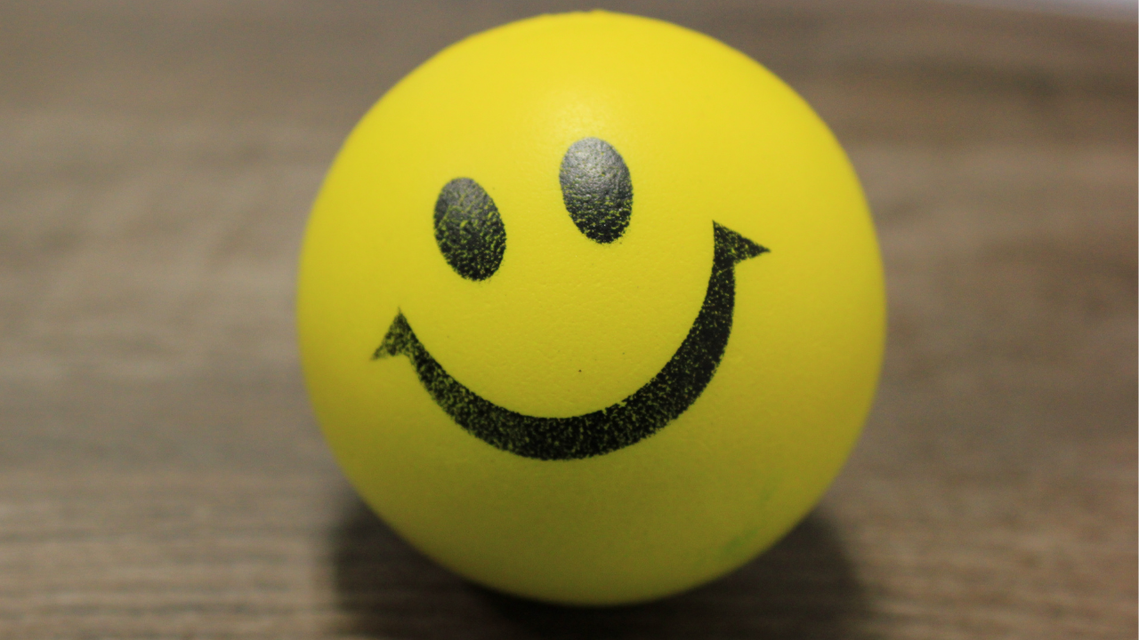 Happy face squeezy ball