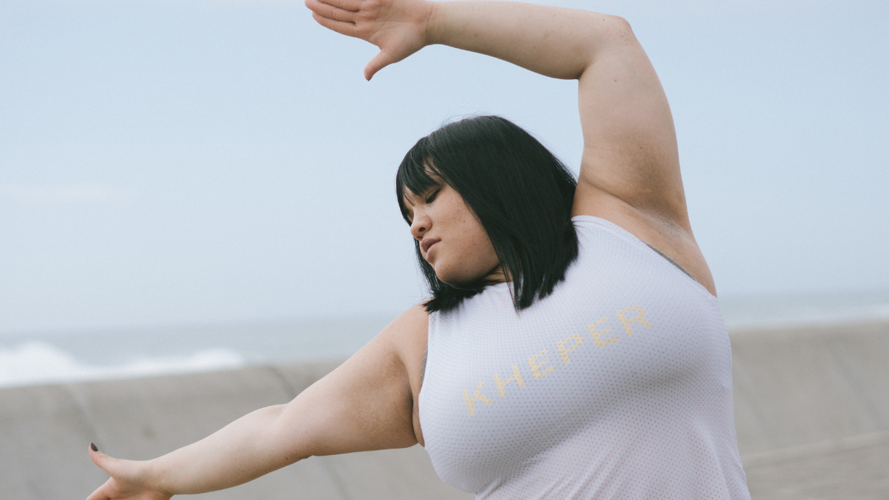 larger woman stretching outside